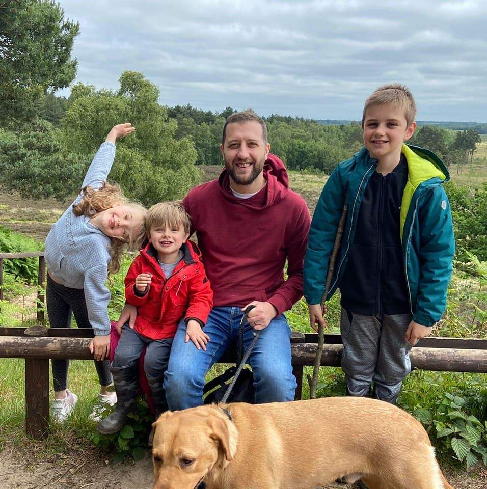 Ben with his three children and the family dog